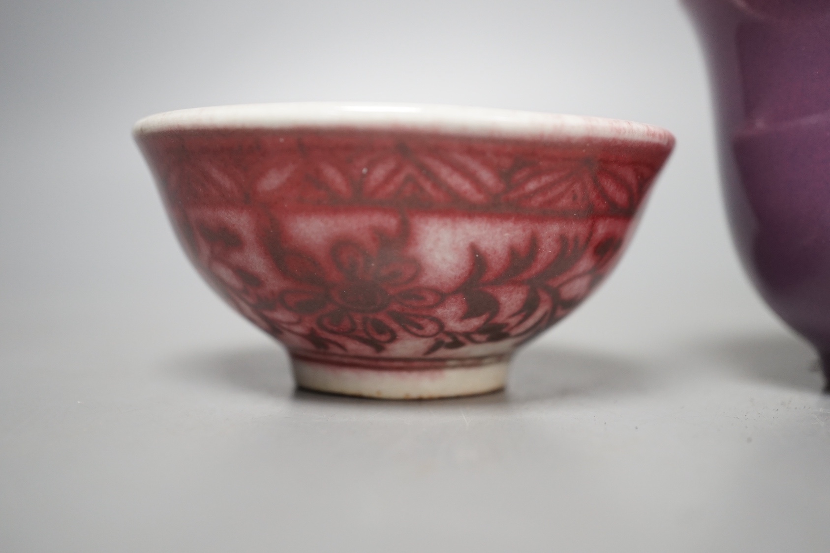 A Chinese copper red glazed bowl and two others